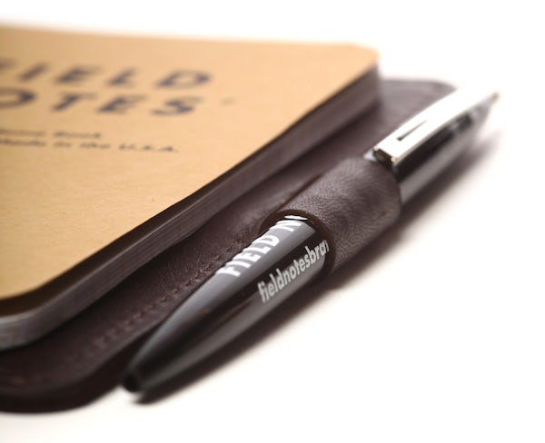 Close up of the pen loop with a notebook inside the Daily Carry leather notebook cover.